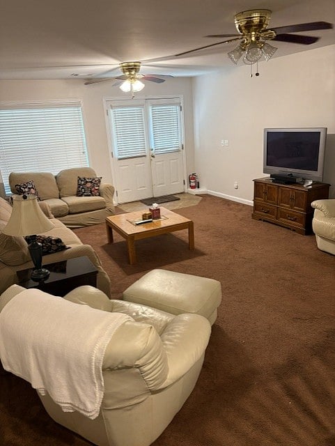 Living room area. Couch, chair, two love seats, coffee table, TV, doors leading out to covered patio.