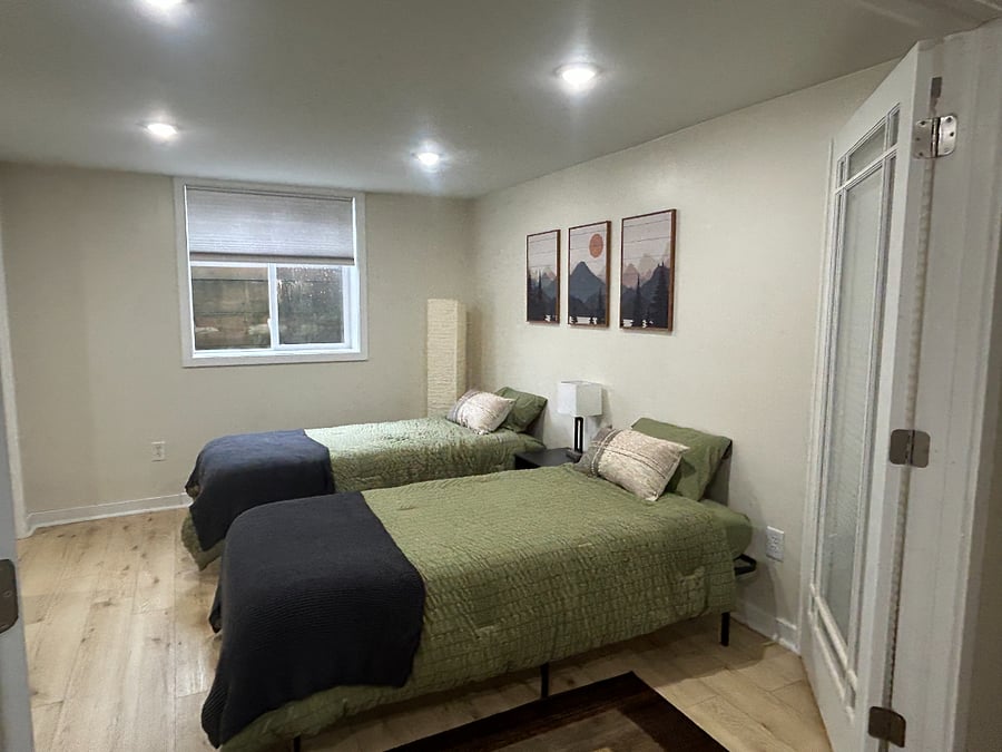 Downstairs "Mountain" room with options of 2 twin beds or 1 large king with 2 inch bonus topper for added comfort