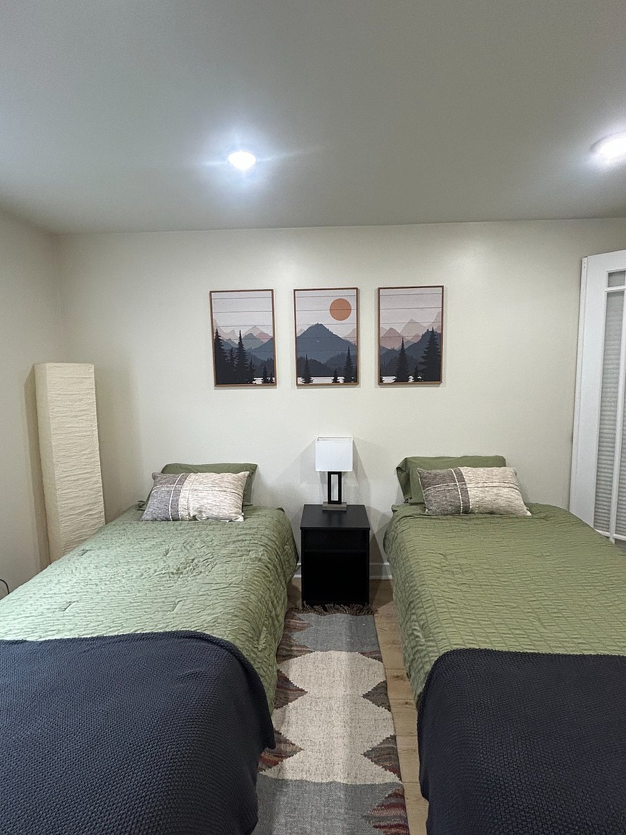 Downstairs "Mountain" room with options of 2 twin beds or 1 large king with 2 inch bonus topper for added comfort