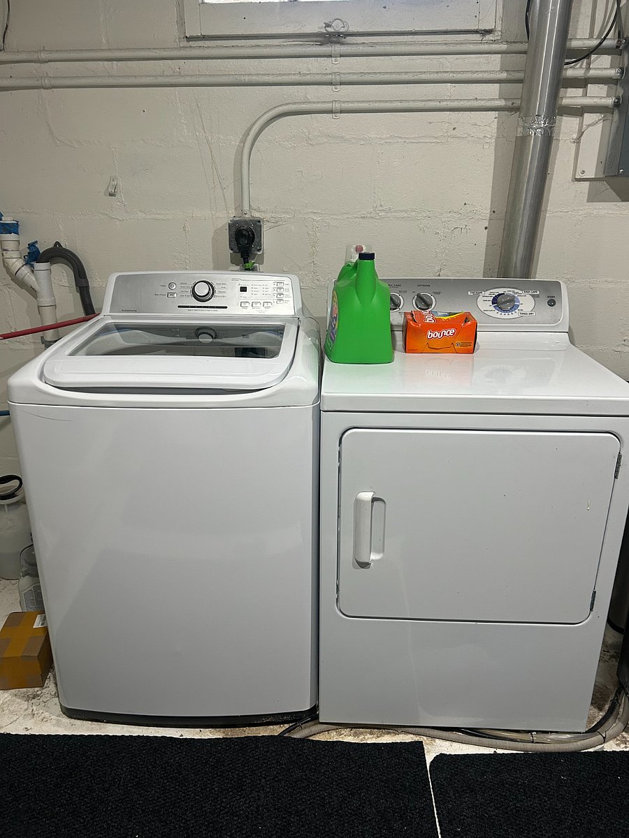 Full size washer and dryer located in downstairs utility room