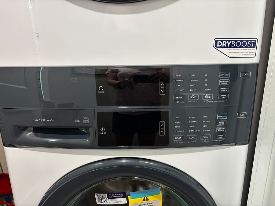 Elextrolux Laundry Center with controls in the middle for easy reach.