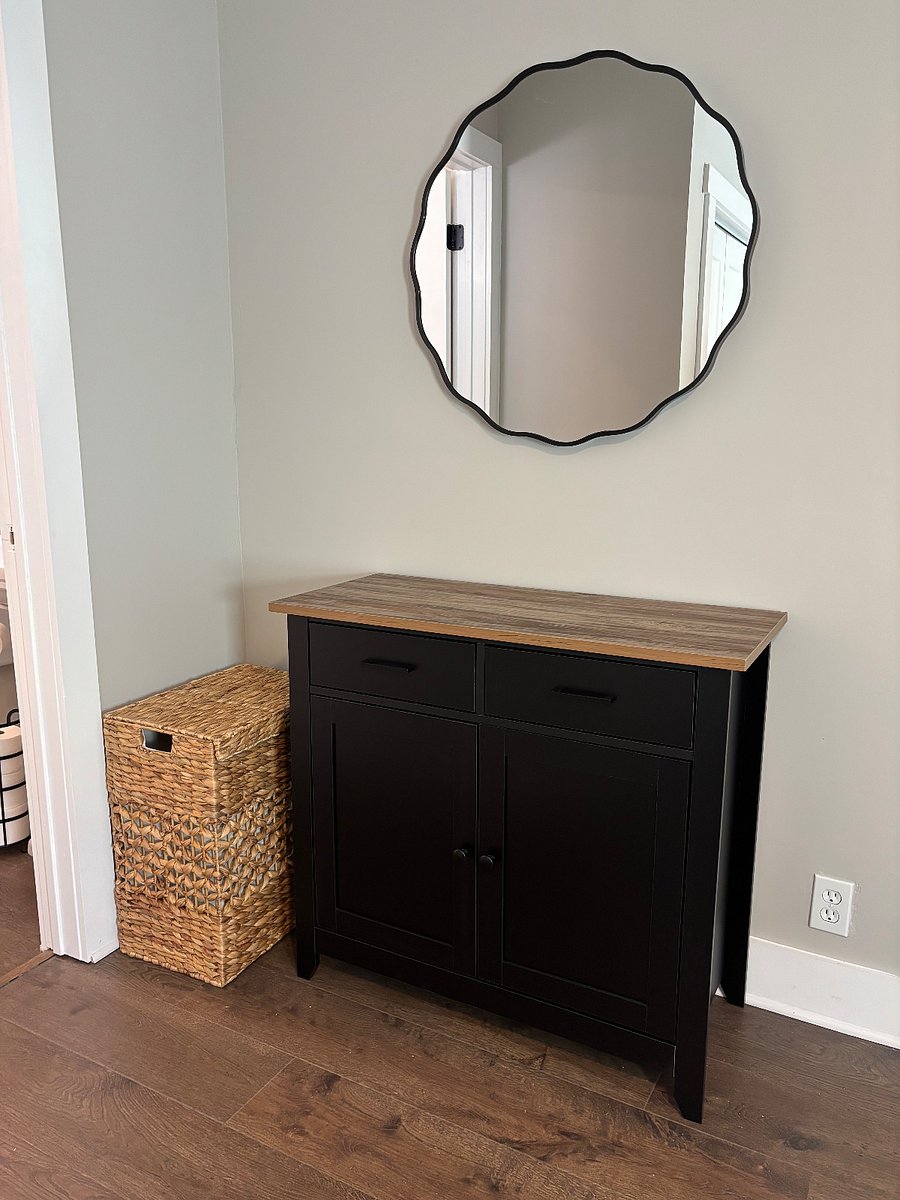 This is a linen cabinet, make up center located just outside of the bathroom The bathroom is small, and this nook extends the counter space for personal items.