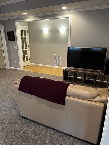 Vizio 55" Smart TV, leather loveseat and blanket.