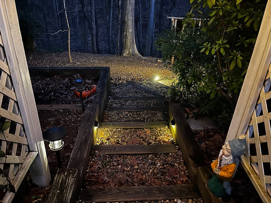 Well lit path at night controlled by two remotes for safety. Solar pathway lights for dusk.