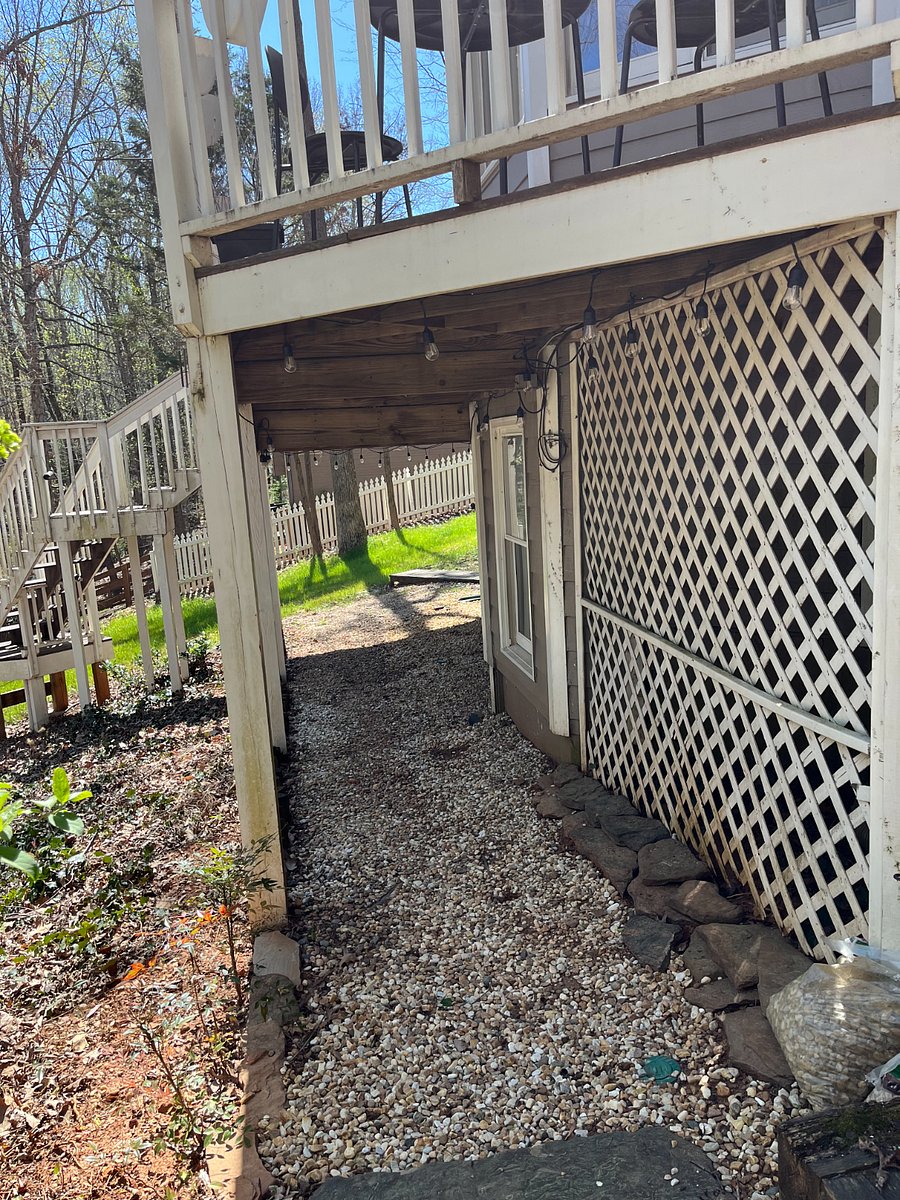Under deck walkway to apartment entrance.