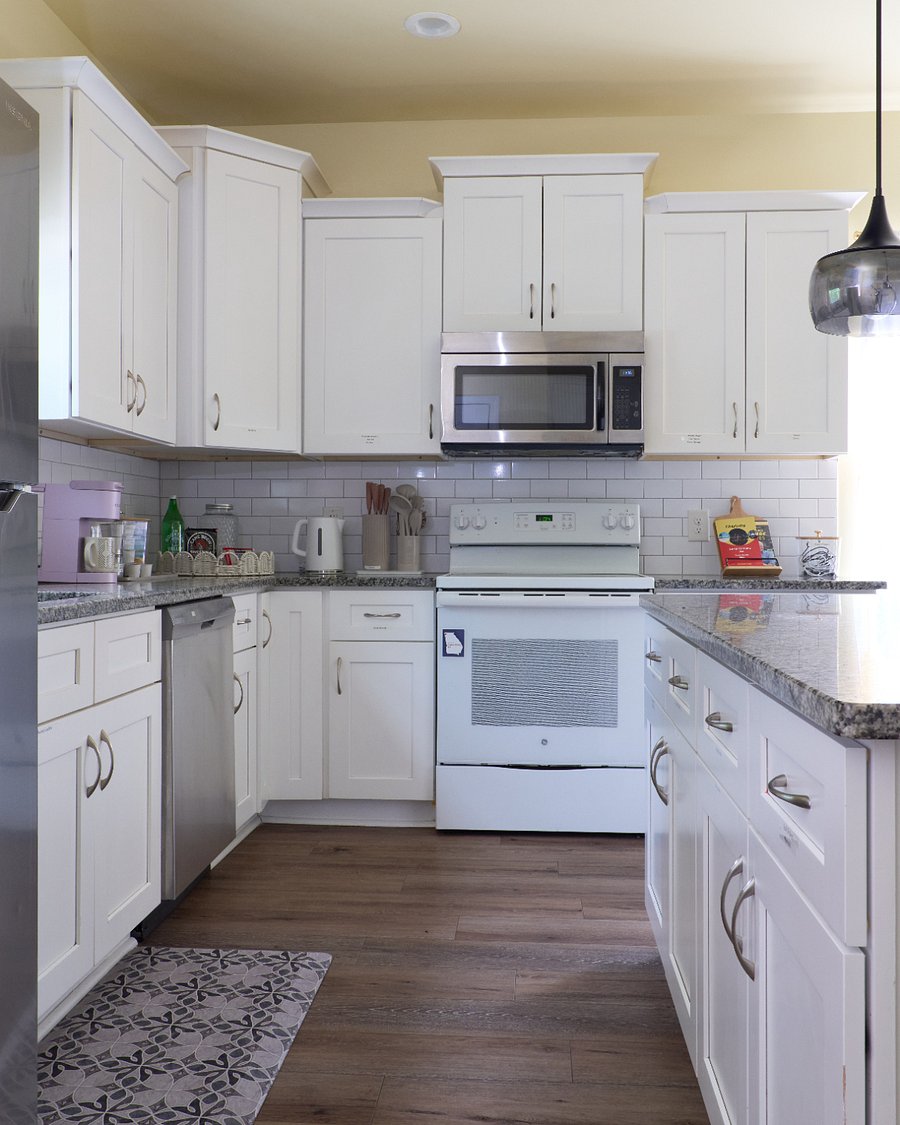 Prepare meals in a bright, well-equipped kitchen with plenty of storage and appliances