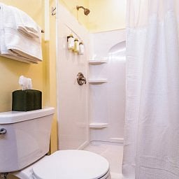 Enjoy a polished bathroom set up with fresh towels and shower essentials