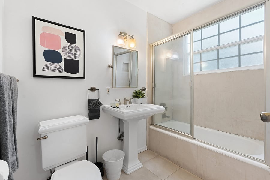 Step in, unwind, and enjoy a spa-like experience in this sleek bathroom space.