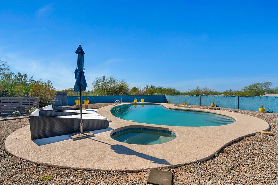 Step into your private outdoor retreat featuring a crystal-clear pool and soothing hot tub. Surrounded by peaceful scenery, its the perfect escape from the everyday.