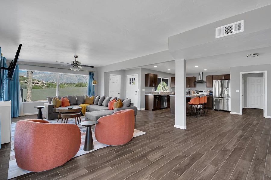 Kick back in a cozy living space featuring a soft sofa, streaming TV, and charming dcor. The rooms warm lighting and welcoming vibe make it ideal for relaxing after a busy day of adventure.