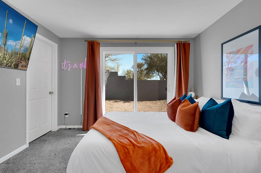 Unwind in this cozy bedroom featuring a plush queen bed, soft linens, and a smart TV for streaming your favorite shows. A perfect mix of comfort and convenience for a relaxing stay.