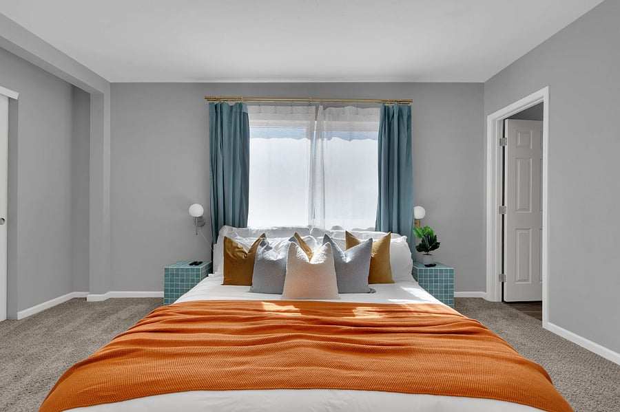 Enjoy a restful stay in this stylish bedroom with a plush bed for two, soft lighting, and a flat-screen TV. Perfect for unwinding with a movie after a day of exploring.