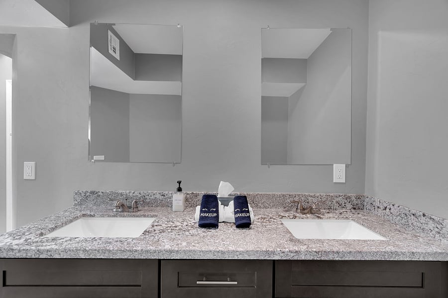 This inviting bedroom offers a comfortable bed for two, natural light, and a flat-screen TV. Perfect for guests seeking both relaxation and convenience during their stay.