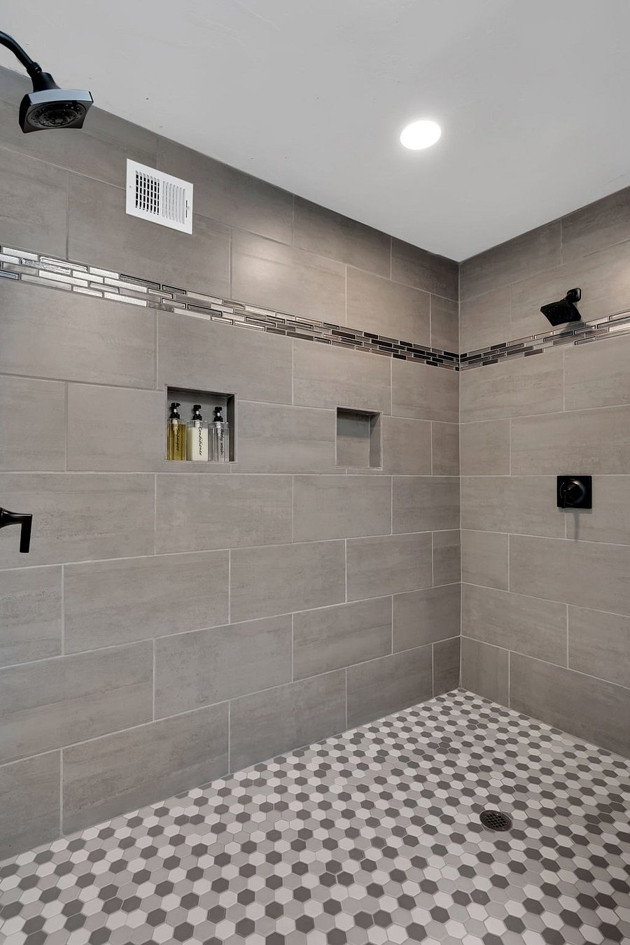 Start your morning in this bright, well-appointed bathroom with fresh linens, great lighting, and all the essentials for a refreshing experience.
