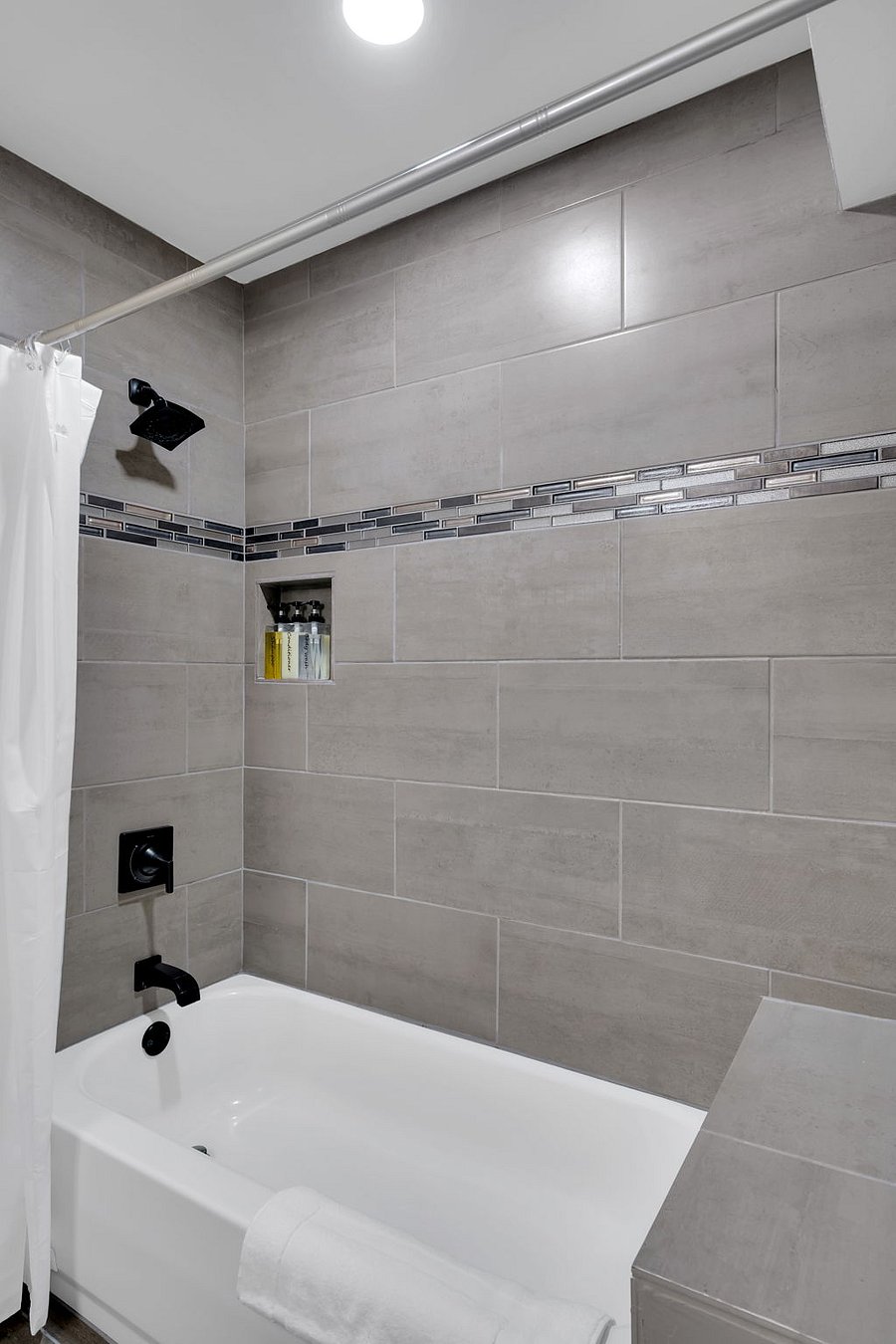 Enjoy a clean, elegant bathroom complete with modern fixtures, a spacious shower, and quality amenitieseverything you need for a comfortable stay.