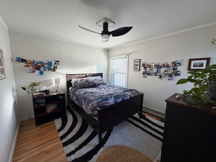 Bedroom 1 with large closet, dressers, and backyard privacy. Great morning sunlight