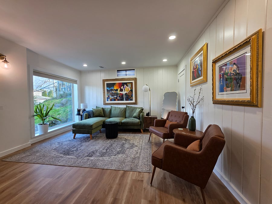 Large and comfortable living room with big picture window with view of Lake Washington and the Cascades.