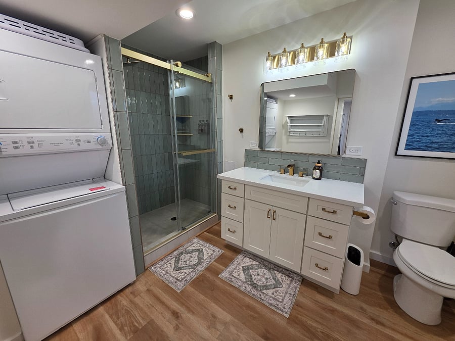 Washer and dryer in unit. Rainfall shower with hand held shower.