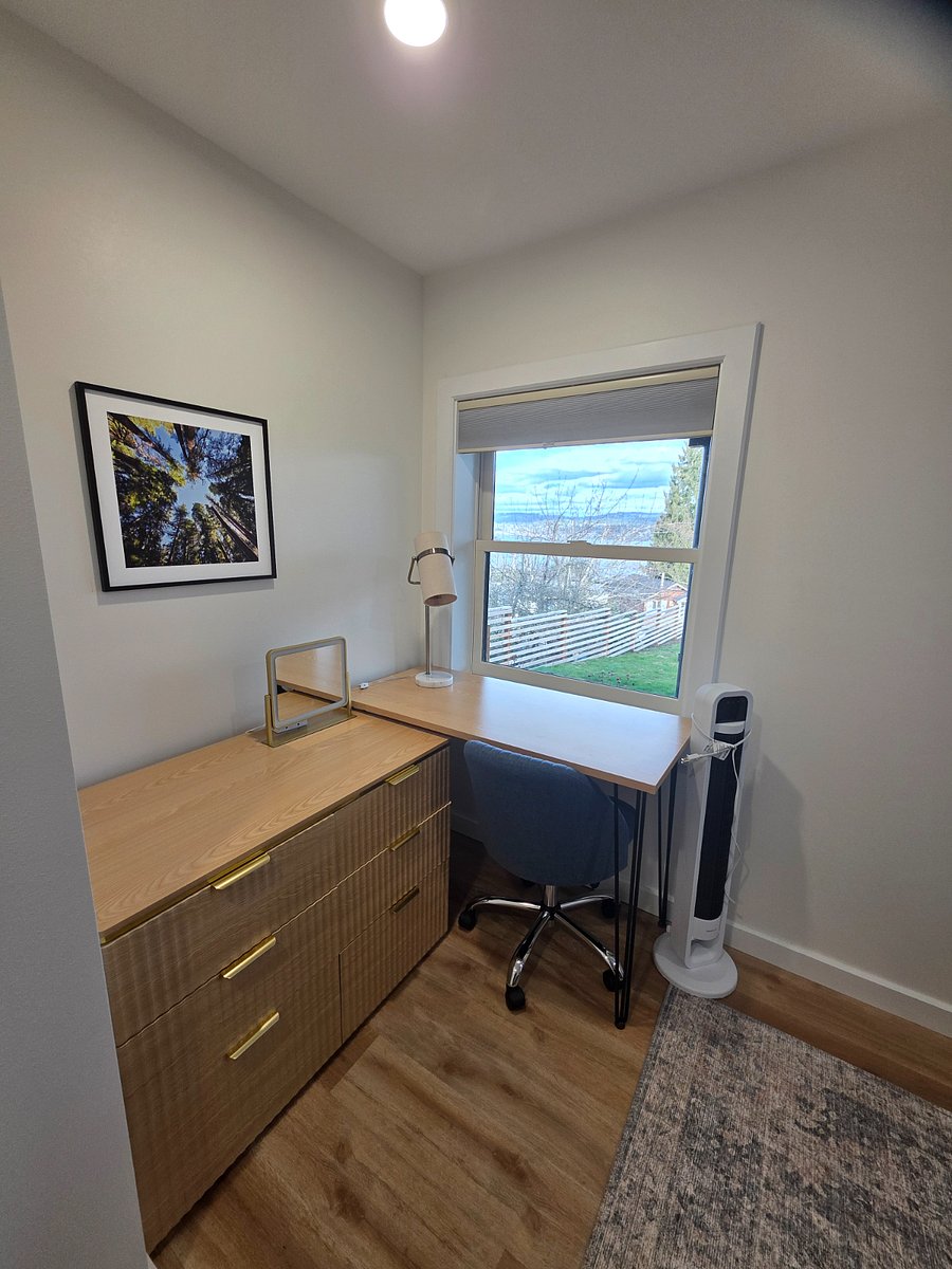 Office area and dresser in bedroom.