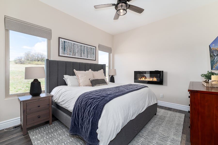 The shades are black out and Hunter Douglas automated w/ a remote. There is a TV and an electric fireplace in the bedroom. 