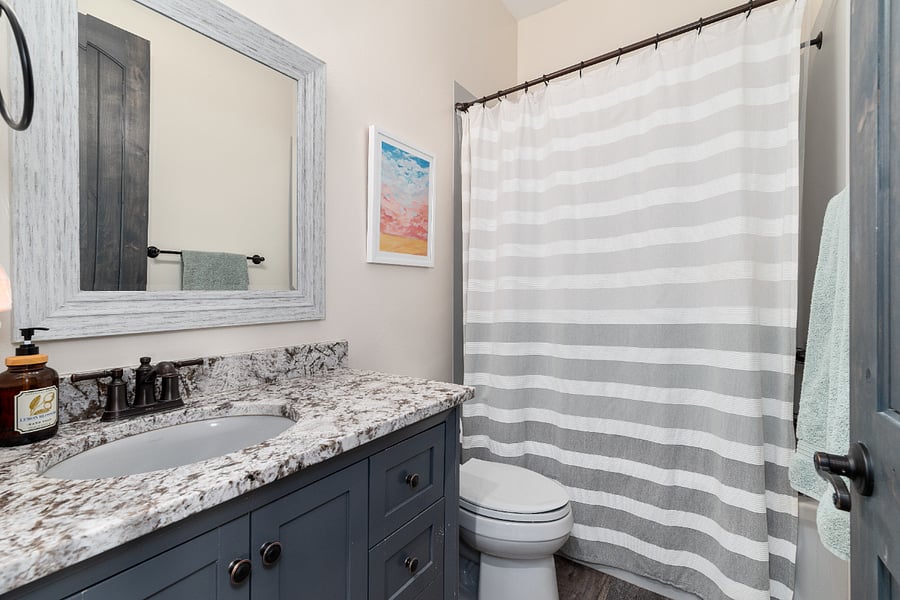 Bathroom for second bedroom, it has a tub. 