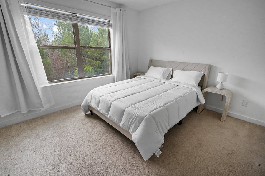 Spacious bedroom with soft bedding and a relaxing feel.