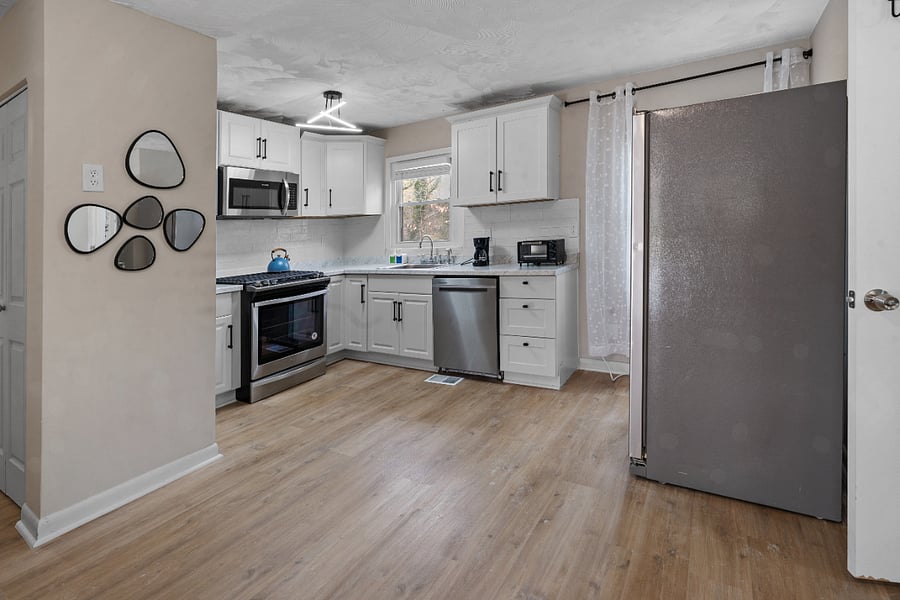 Fully equipped kitchen with modern appliances.