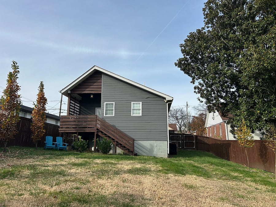 Rear view of home and back yard