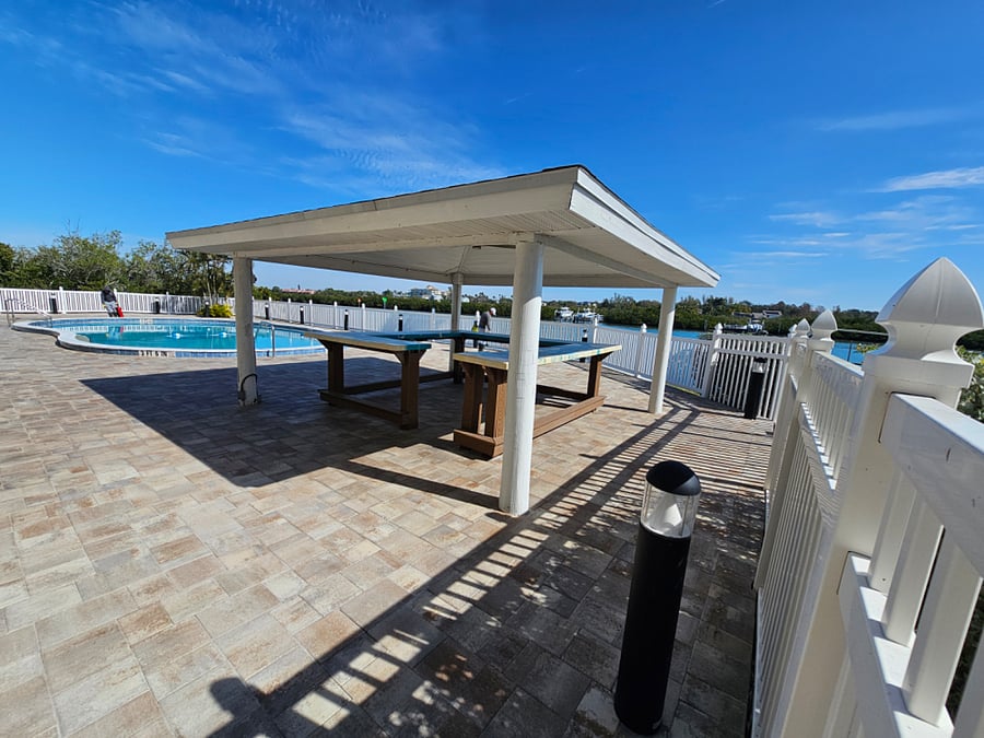 The pool area features a Lanai and 2 gas grills for guest use.