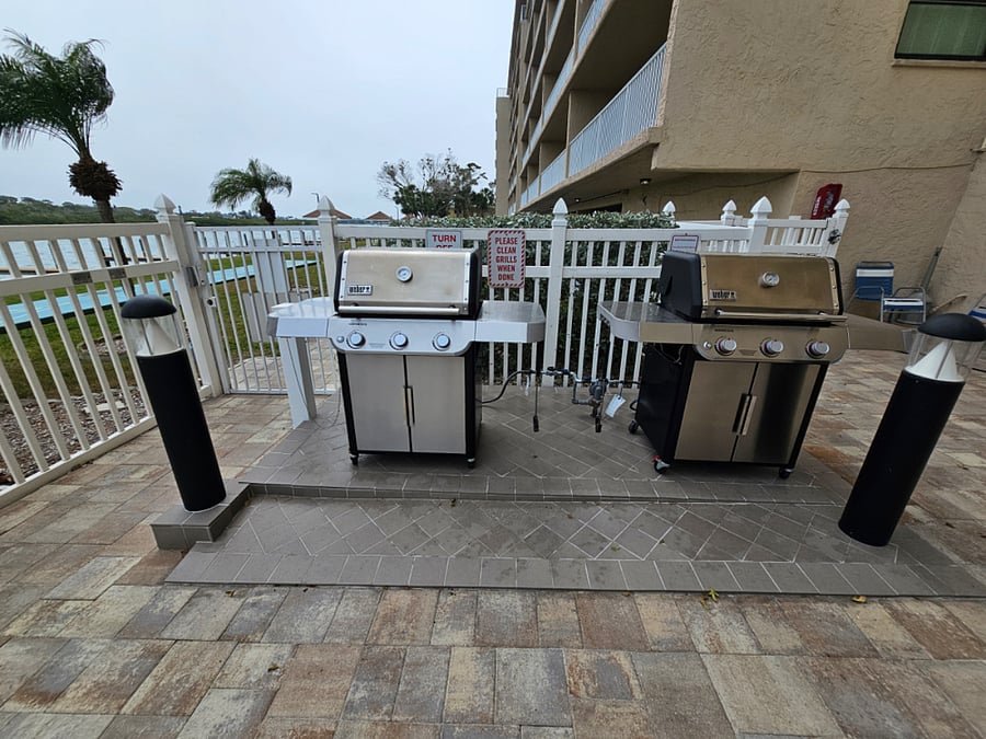 The pool area features a Lanai and 2 gas grills for guest use.