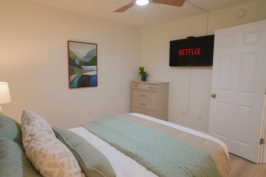Guest Bedroom features a Queen Bed and a Twin Trundle, TV w/ streaming, closet and dresser.