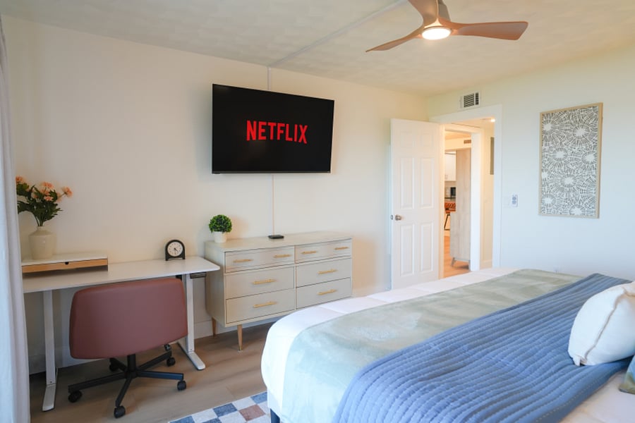 Adjustable standing desk in primary bedroom