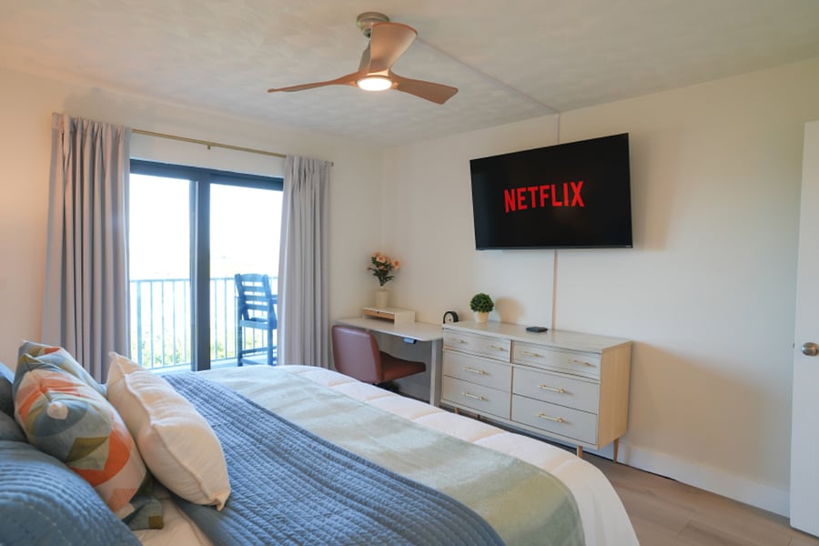 Primary Bedroom features a King Bed and a pullout twin cot, a 55" Smart TV and a wall-in closet