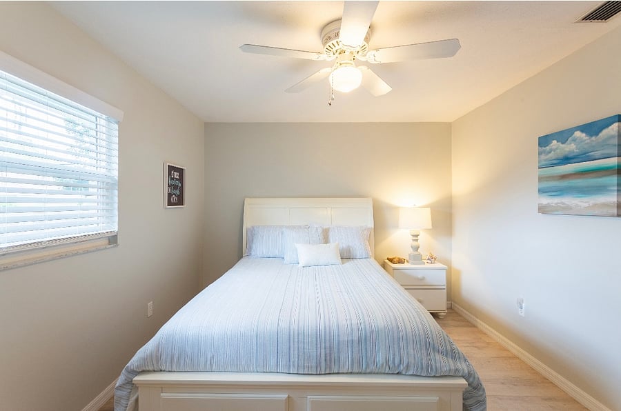 Queen bedroom with memory foam mattress, dresser and large closet