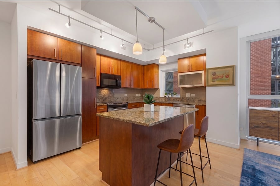 Cook in style in this modern kitchen equipped with premium stainless steel appliances and ample counter space.
