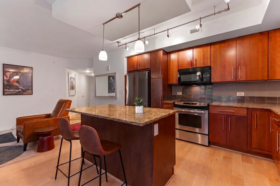 Enjoy your morning coffee or a casual meal at the spacious granite island with comfortable bar seating.
