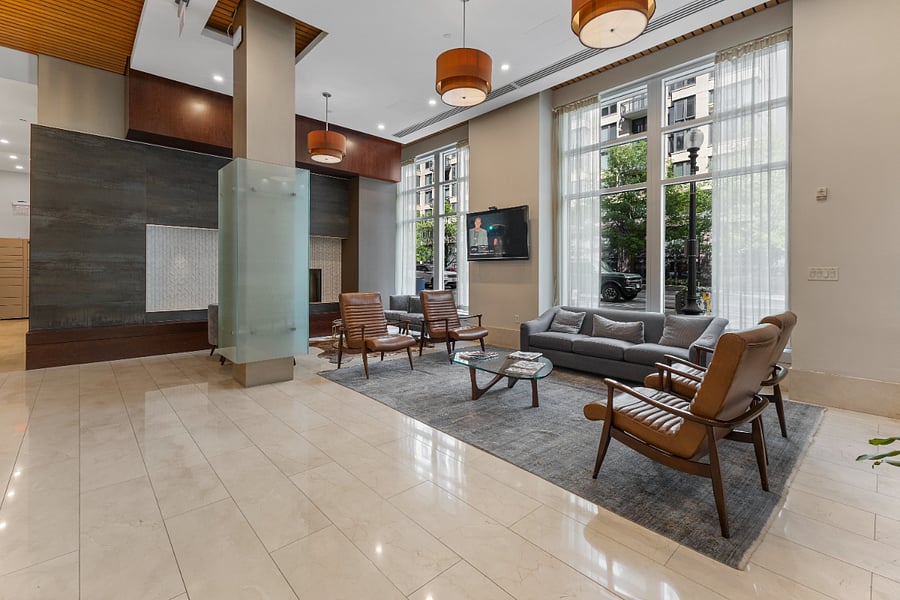 Experience a grand welcome in the building's designer lobby, offering a sophisticated lounge area for guests or quiet reading.
