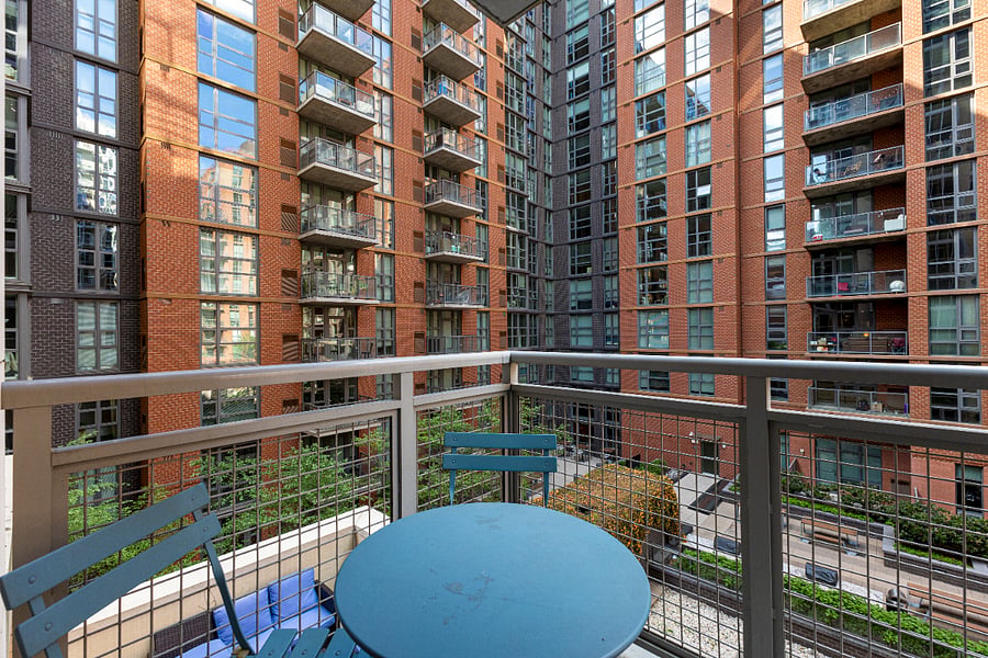 Step outside to your private balcony, the perfect spot for a morning coffee or an evening drink while taking in the vibrant urban courtyard views.

