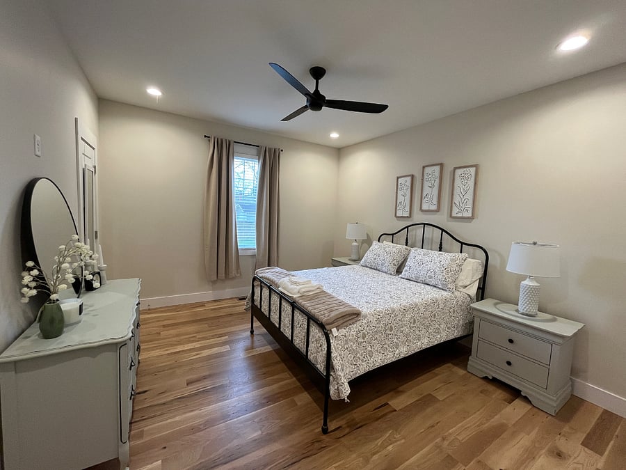 Bedroom with full length mirror and blackout curtains