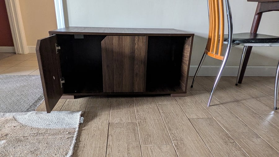 Cat owners: this beautiful cabinet can conceal your litter box! Cats enter via a hole inside