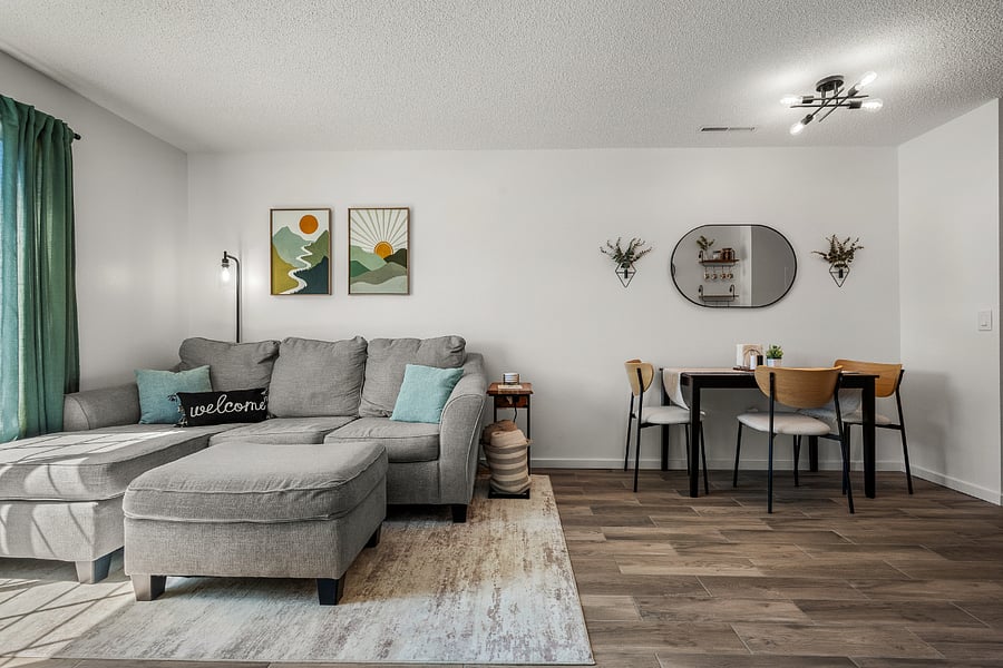 Living and dining room (seat up to 4!) Couch pulls out to a queen bed to accommodate any visitors!