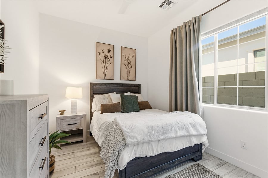 Blackout curtains and shade in guest bedroom