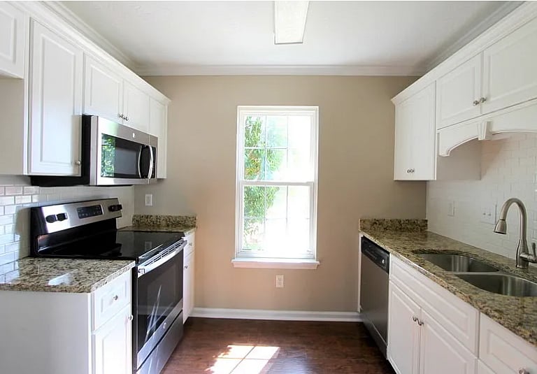 Fully equipped kitchen with modern appliances and plenty of space for meal prep.