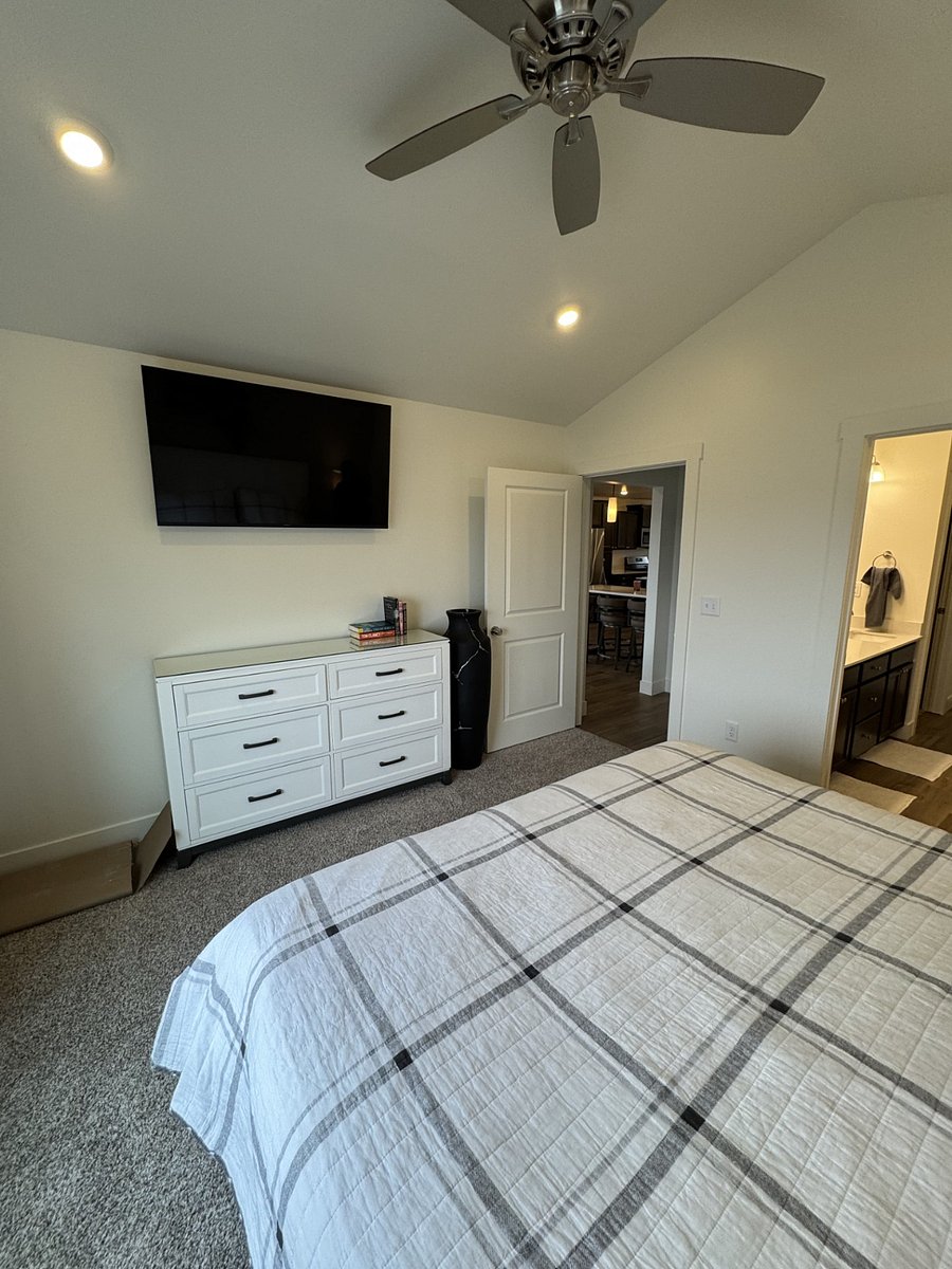Main bedroom - dresser and 55" TV