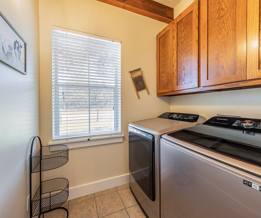 The laundry room is located on the first floor and has a full-size washer and dryer.