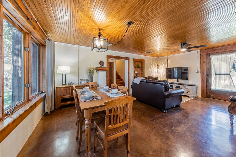 Dining table that seats six, with linens provided.