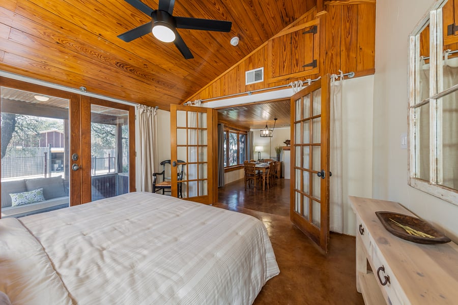 Primary suite opens to living area and has private porch.