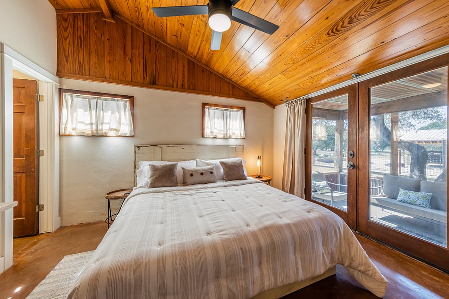 King bed with custom-built barn wood headboard.