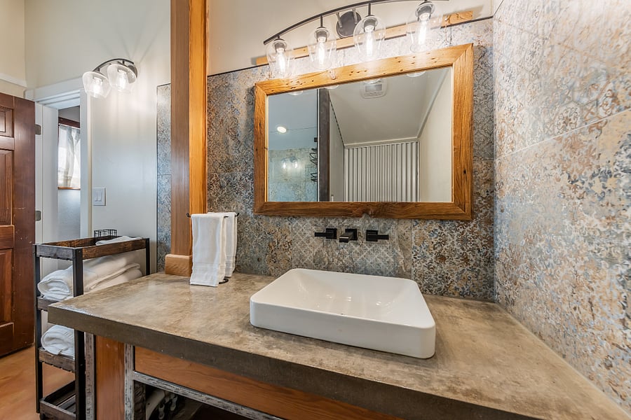 Vessel sink with tile surround.