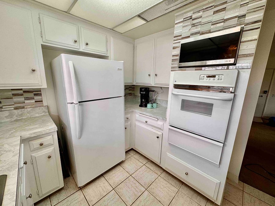 Kitchen with oven and microwave